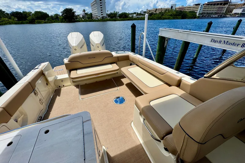  Yacht Photos Pics 2023 Chris-Craft Calypso 28 boat interior with seating and twin Mercury engines.