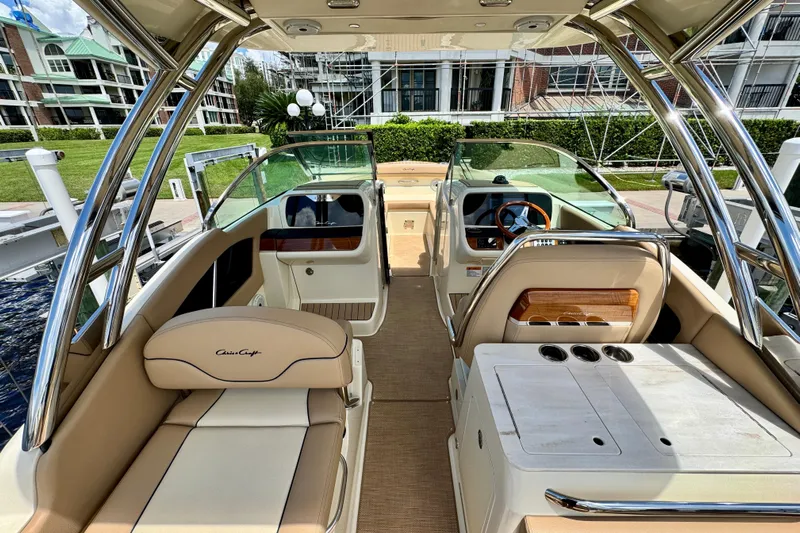  Yacht Photos Pics 2023 Chris-Craft Calypso 28 boat interior with luxurious seating and modern dashboard.