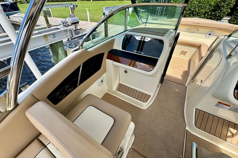  Yacht Photos Pics 2023 Chris-Craft Calypso 28 interior with beige seating and elegant design.