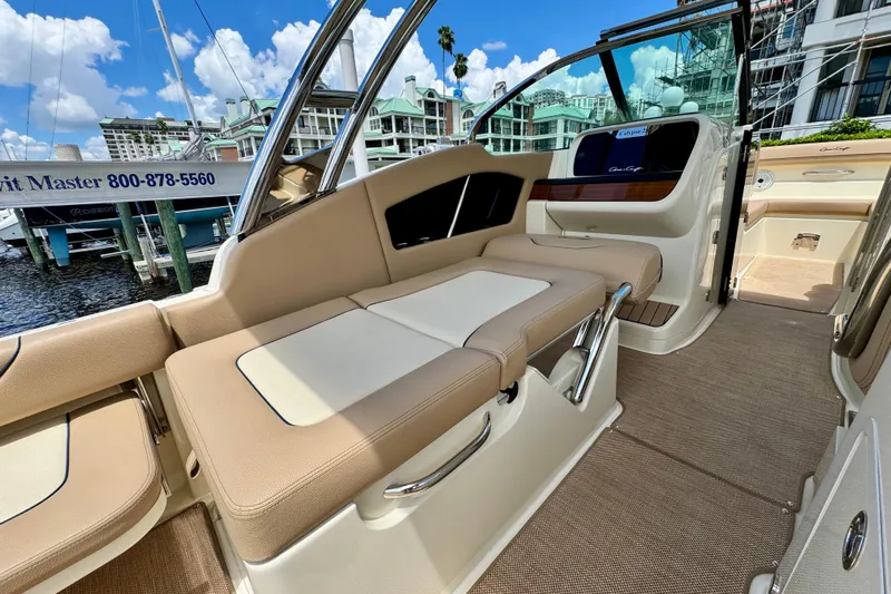  Yacht Photos Pics 2023 Chris-Craft Calypso 28 interior with beige seating and elegant design.