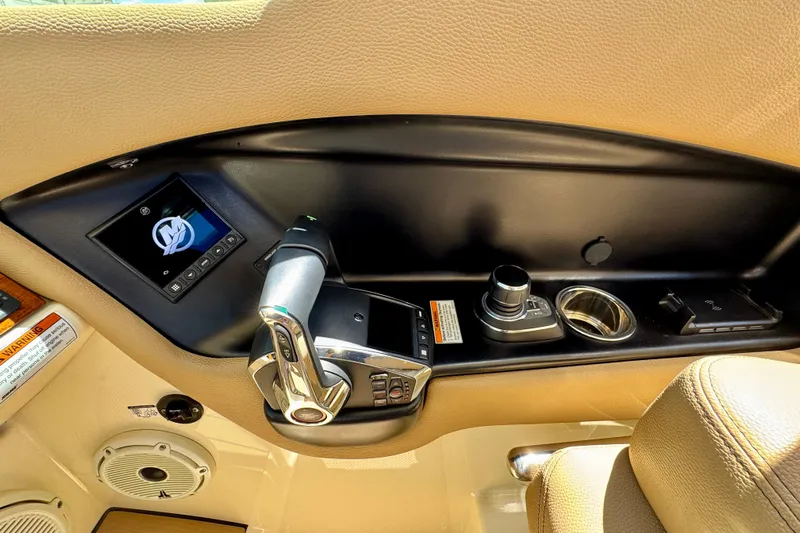  Yacht Photos Pics 2023 Chris-Craft Calypso 28 boat control panel with joystick and display screen.