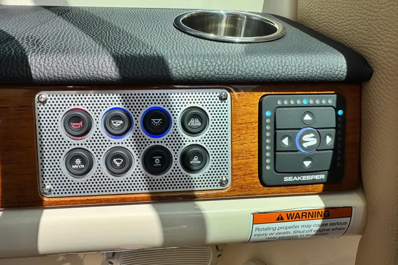  Yacht Photos Pics Control panel of 2023 Chris-Craft Calypso 28 boat with Seakeeper system and warning label.