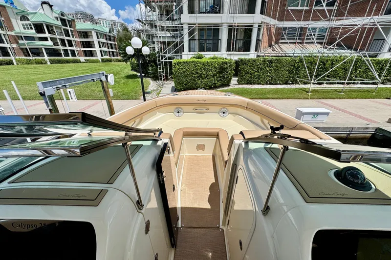  Yacht Photos Pics 2023 Chris-Craft Calypso 28 boat docked, showcasing elegant interior and modern design.