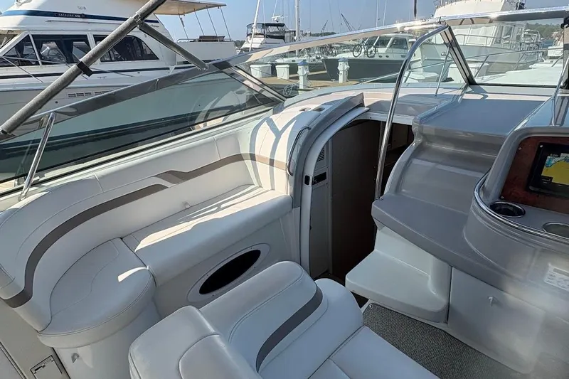  Yacht Photos Pics 2001 Formula 400ss boat interior with white seating and dashboard, docked at marina.