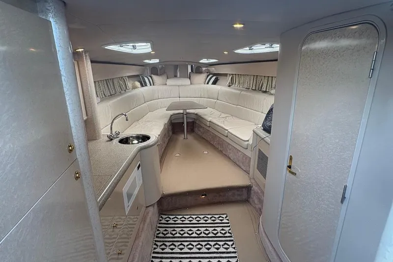  Yacht Photos Pics Interior of a 2001 Formula 400ss boat with plush seating and kitchenette.