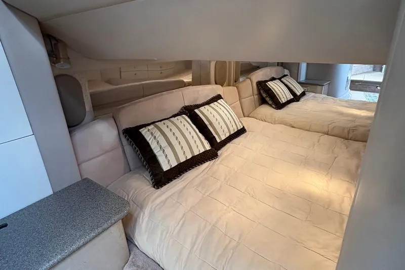  Yacht Photos Pics Interior of a 2001 Formula 400ss boat with twin beds and decorative pillows.