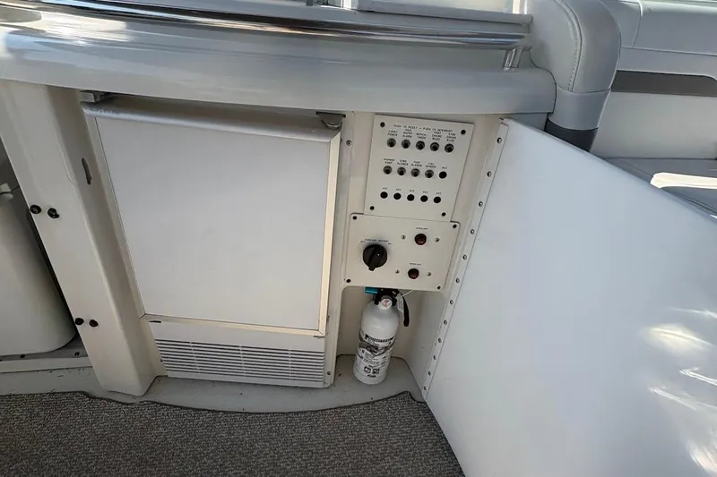  Yacht Photos Pics 2001 Formula 400ss boat interior with control panel and mini fridge.