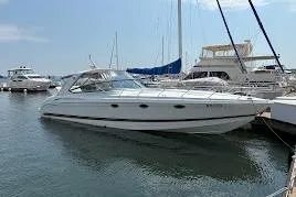  Yacht Photos Pics 2001 Formula 400ss yacht docked at marina, surrounded by other boats.