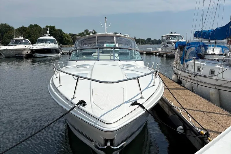  Yacht Photos Pics 2001 Formula 400ss boat docked in a marina, surrounded by other vessels.