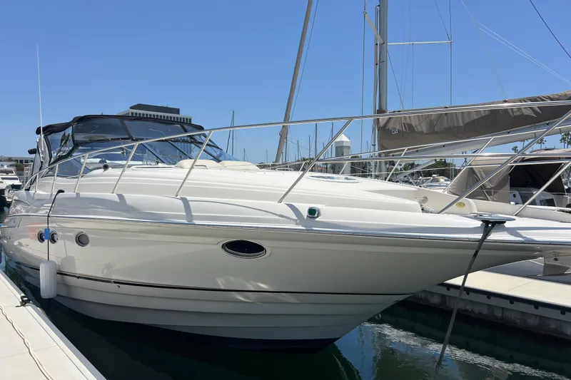 Bella Olivia Yacht Photos Pics 2000 Regal Commodore 4160 yacht docked at marina under clear blue sky.