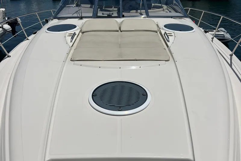 Bella Olivia Yacht Photos Pics 2000 Regal Commodore 4160 yacht deck with sunbathing area and circular hatches.