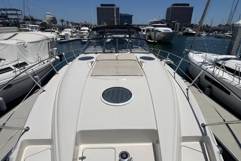 Bella Olivia Yacht Photos Pics 2000 Regal Commodore 4160 yacht docked in a marina, surrounded by other boats.