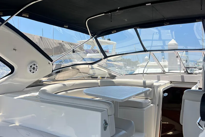 Bella Olivia Yacht Photos Pics Luxurious interior of 2000 Regal Commodore 4160 yacht with sleek seating and table.