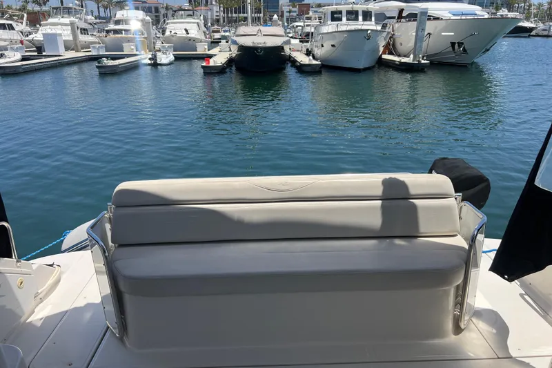 Bella Olivia Yacht Photos Pics Rear view of a 2000 Regal Commodore 4160 yacht docked at a marina.