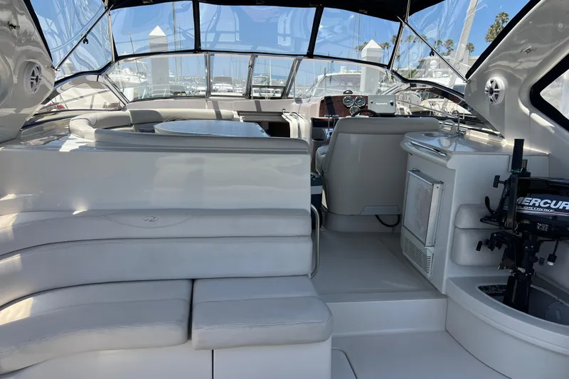Bella Olivia Yacht Photos Pics Interior of 2000 Regal Commodore 4160 yacht with seating and navigation area.