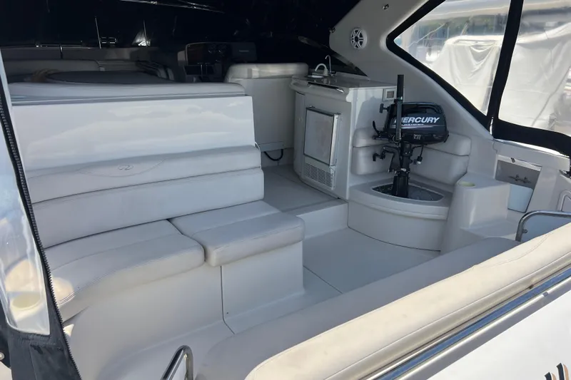 Bella Olivia Yacht Photos Pics Interior of 2000 Regal Commodore 4160 yacht with seating and Mercury engine.