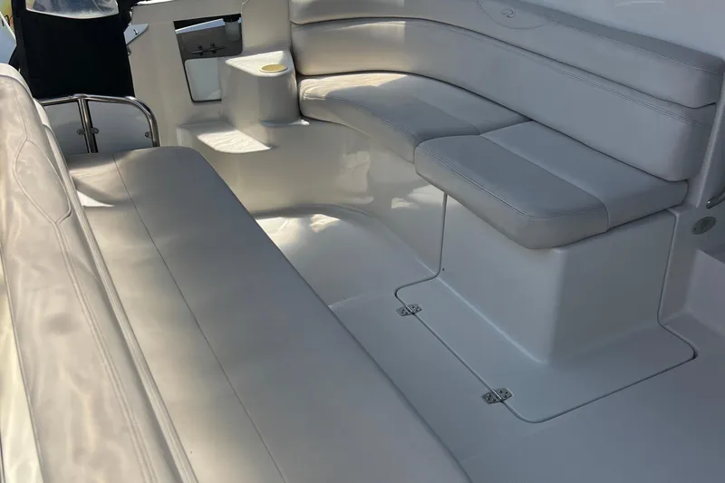 Bella Olivia Yacht Photos Pics Luxurious seating area on a 2000 Regal Commodore 4160 boat, featuring white upholstery.