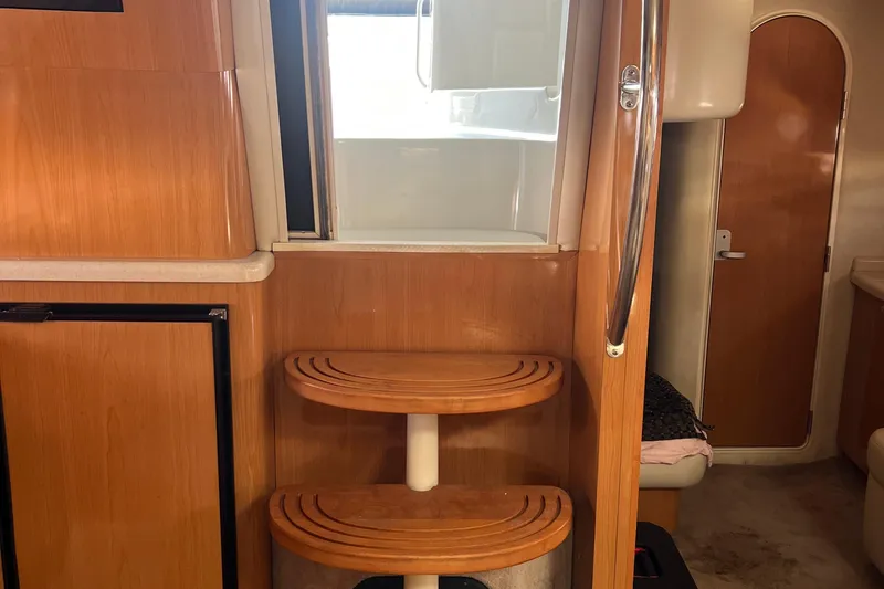 Bella Olivia Yacht Photos Pics Interior of 2000 Regal Commodore 4160 yacht with wooden steps and modern design.