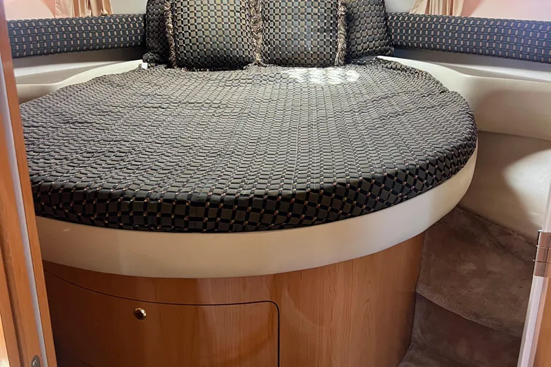 Bella Olivia Yacht Photos Pics Cozy cabin interior of 2000 Regal Commodore 4160 with patterned bedding.