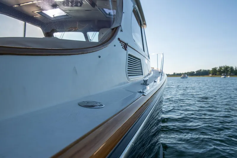 Eroica Yacht Photos Pics 2005 Hinckley Talaria 40 yacht on calm water, side view.