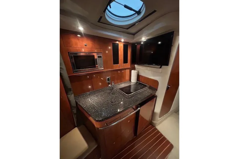 Gorgie Yacht Photos Pics Luxurious 2008 Four Winns 338 Vista yacht interior with modern kitchen amenities.