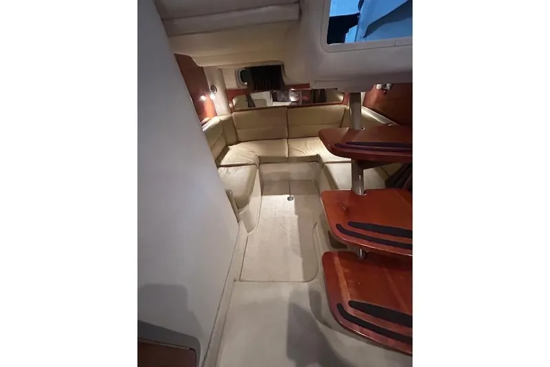 Gorgie Yacht Photos Pics 2008 Four Winns 338 Vista interior with beige seating and wooden steps.