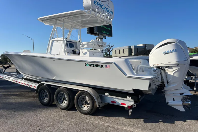  Yacht Photos Pics 2026 Contender 28 Tournament boat on trailer with Yamaha engine, parked outdoors.