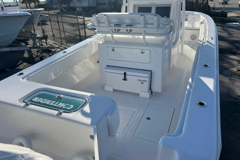  Yacht Photos Pics 2026 Contender 28 Tournament boat interior with seating and storage compartments.