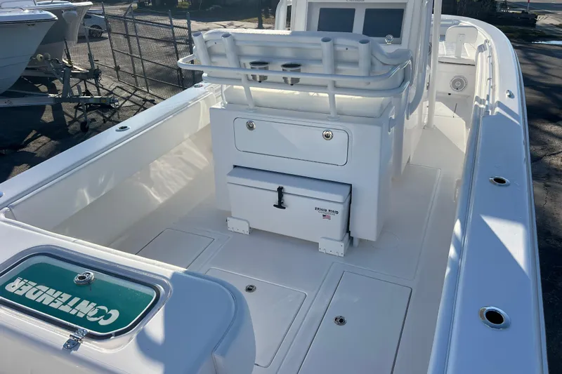  Yacht Photos Pics 2026 Contender 28 Tournament boat interior with seating and storage compartments.