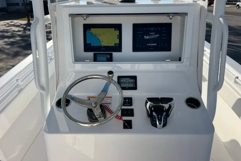  Yacht Photos Pics Helm of 2026 Contender 28 Tournament boat with navigation screens and controls.