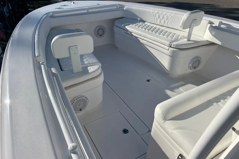  Yacht Photos Pics 2026 Contender 28 Tournament boat interior with white seating and speakers.