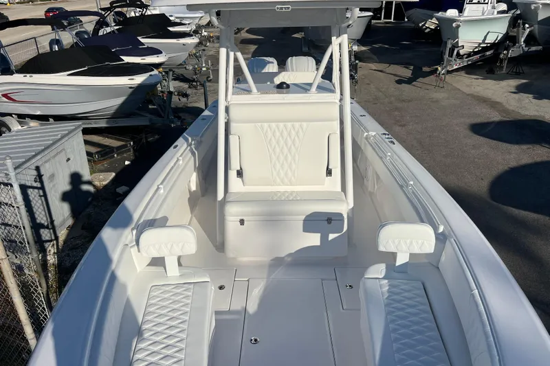  Yacht Photos Pics 2026 Contender 28 Tournament boat with white seating and sleek design.