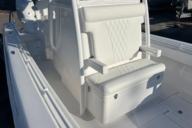  Yacht Photos Pics 2026 Contender 28 Tournament boat with white seating and storage compartment.