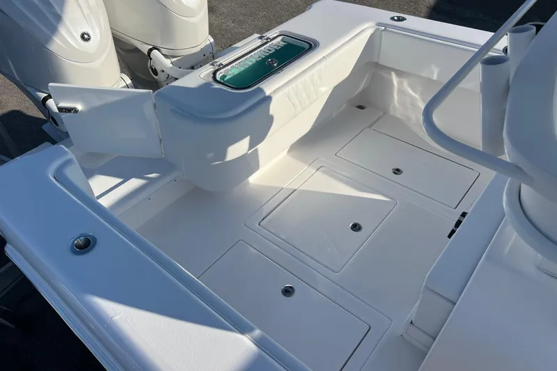  Yacht Photos Pics 2026 Contender 28 Tournament boat deck with storage compartments and twin engines.