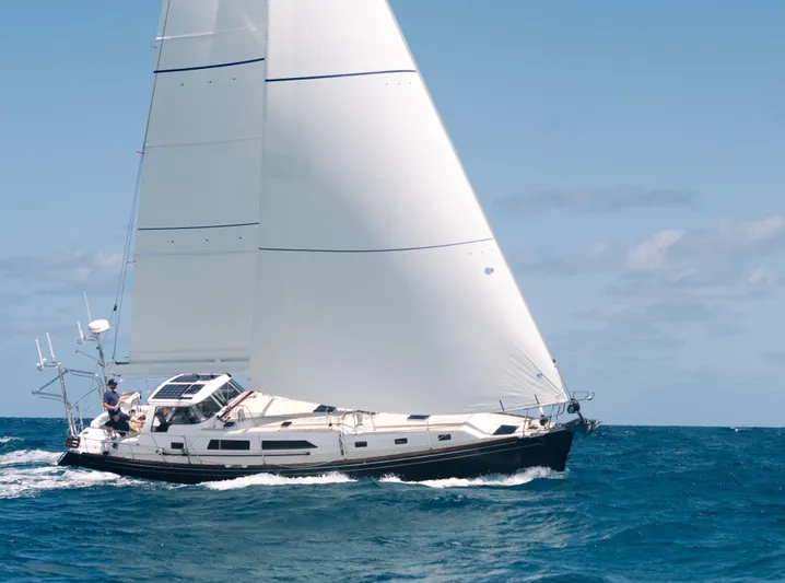 Outbound 46 Yacht Photos Pics Sailing yacht Outbound 46, 2025 model, cruising on open ocean under clear skies.