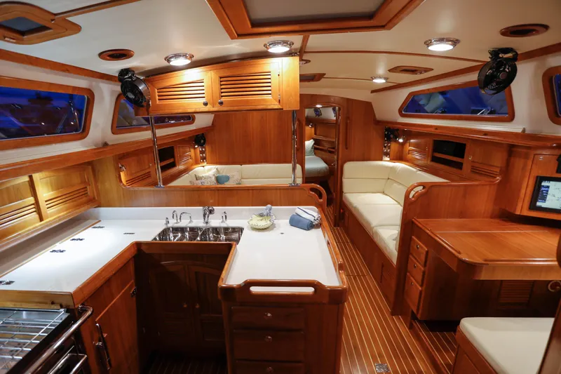 Outbound 46 Yacht Photos Pics Luxurious interior of 2025 Outbound 46 yacht with wooden finishes and modern amenities.