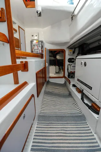 Outbound 46 Yacht Photos Pics Interior of 2025 Outbound 46 yacht with modern design and striped carpet.