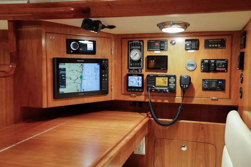 Outbound 46 Yacht Photos Pics Navigation station of 2025 Outbound 46 yacht with advanced control panels and instruments.