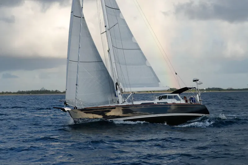 Outbound 46 Yacht Photos Pics Sailing yacht Outbound 46, 2025 model, navigating ocean waters under cloudy skies.