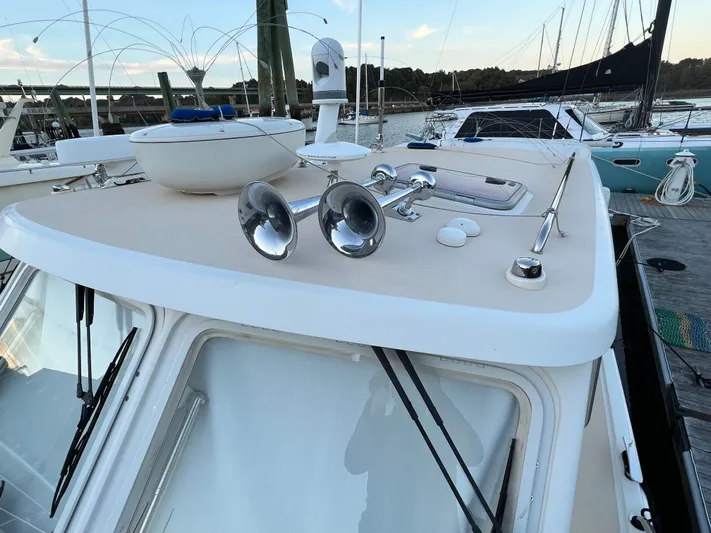 Liberty Yacht Photos Pics 2013 MJM 40z Downeast boat with deck details and docked sailboats in background.