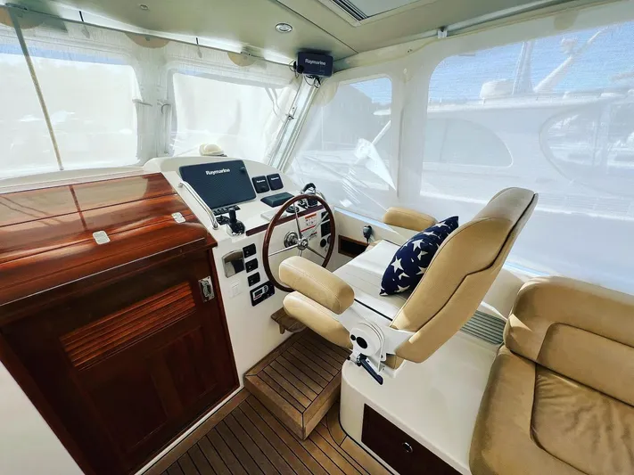 Liberty Yacht Photos Pics Interior of 2013 MJM 40z Downeast boat with helm and seating area.
