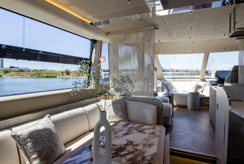  Yacht Photos Pics Luxurious interior of 2026 Galeon 620 FLY yacht with elegant seating and panoramic windows.