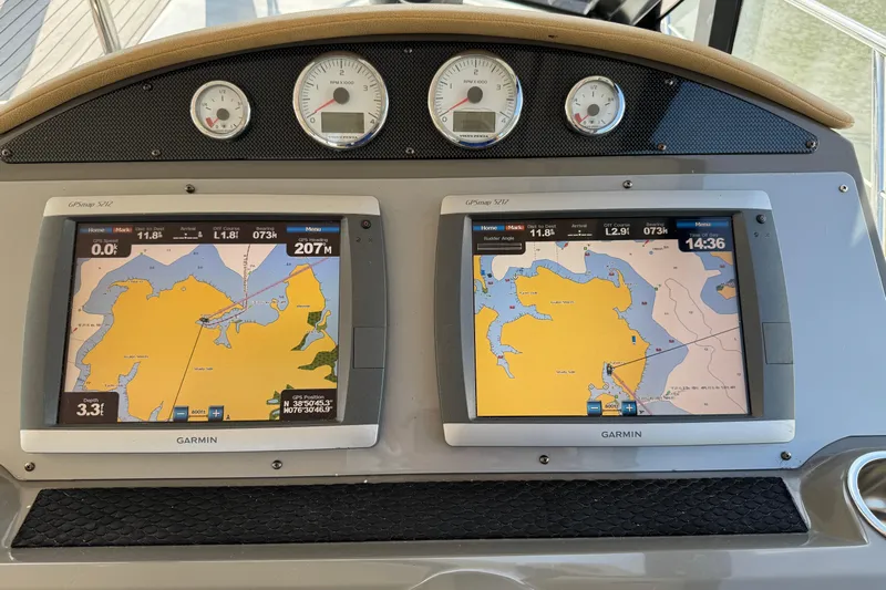  Yacht Photos Pics Dashboard of a 2010 Regal 44 Sport Coupe with Garmin navigation displays.