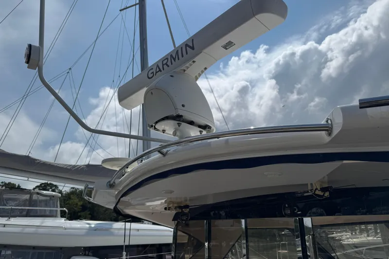  Yacht Photos Pics 2010 Regal 44 Sport Coupe with Garmin radar under cloudy sky.