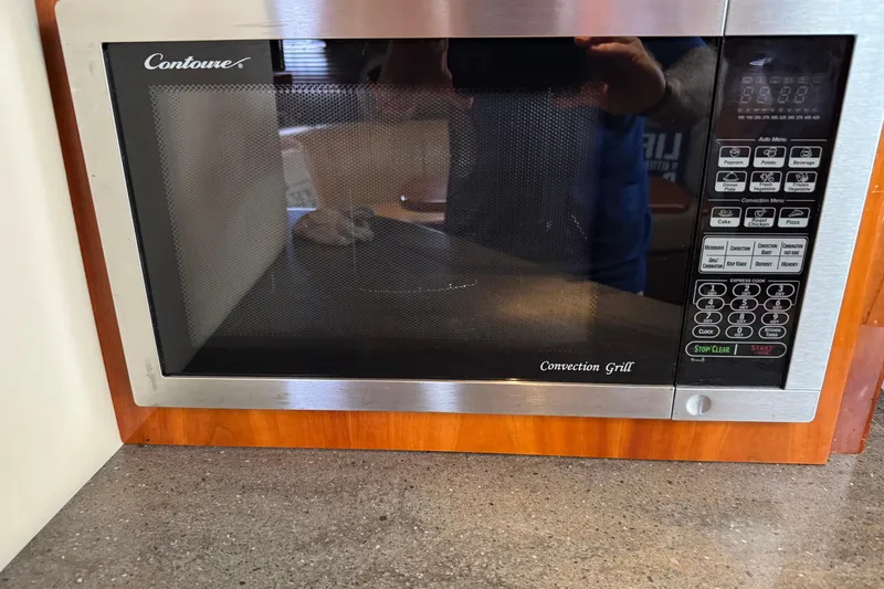  Yacht Photos Pics Built-in Contoure convection grill microwave in 2010 Regal 44 Sport Coupe kitchen.