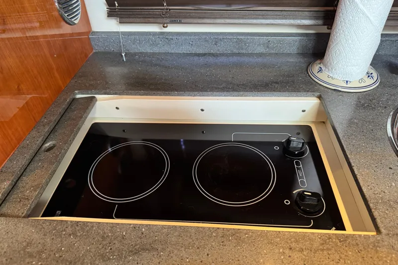  Yacht Photos Pics Built-in electric stove on 2010 Regal 44 Sport Coupe yacht kitchen counter.