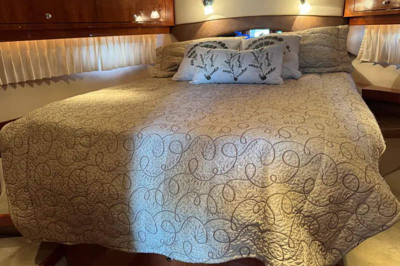  Yacht Photos Pics Luxurious bedroom interior of 2010 Regal 44 Sport Coupe yacht with elegant bedding.