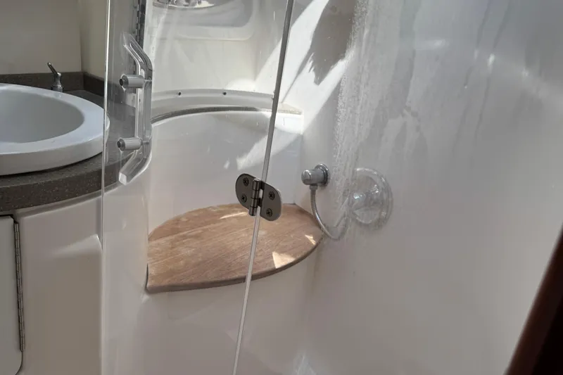  Yacht Photos Pics Bathroom interior of 2010 Regal 44 Sport Coupe yacht with shower and sink.