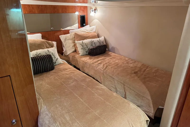  Yacht Photos Pics Interior of 2010 Regal 44 Sport Coupe with twin beds and elegant decor.