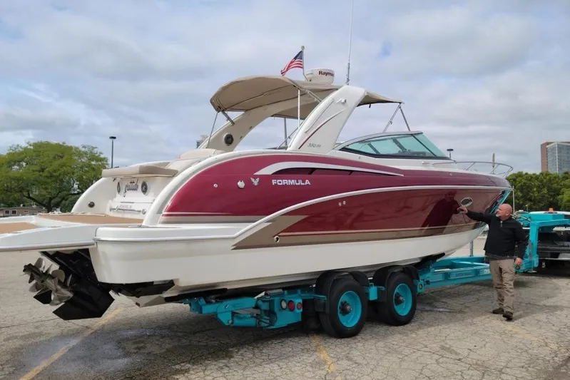 Gratitude Yacht Photos Pics 2015 Formula 350 Sun Sport boat on trailer, red and white design, outdoors.